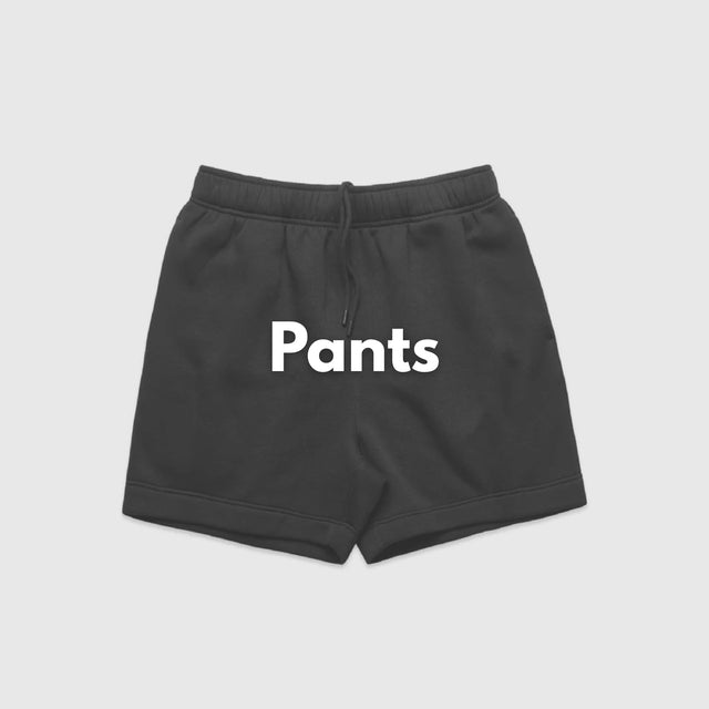 **Alt Text:** Woman standing confidently in gym wearing black activewear shorts – custom sports shorts with free logo included, ideal for fitness teams and events.