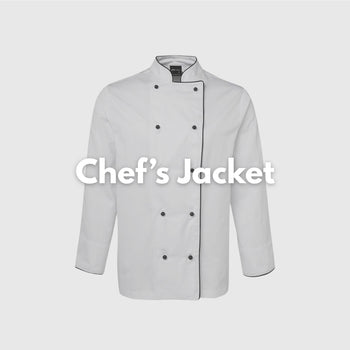 Smiling female chef wearing a crisp white chef jacket in a commercial kitchen – ideal for custom hospitality uniforms, restaurant staff apparel, and professional kitchen branding in Australia.