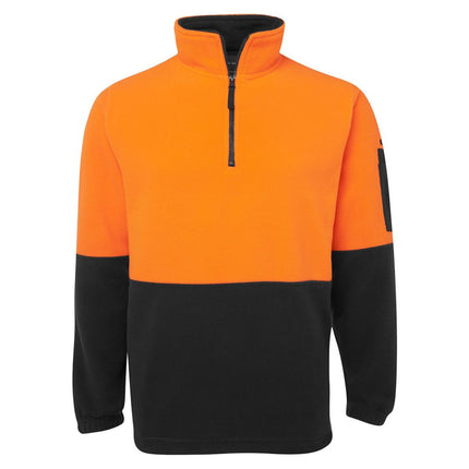 A front view of a two-tone fleece pullover. The top is bright orange, and the bottom and sleeves are black. It has a high collar with a black half zipper.