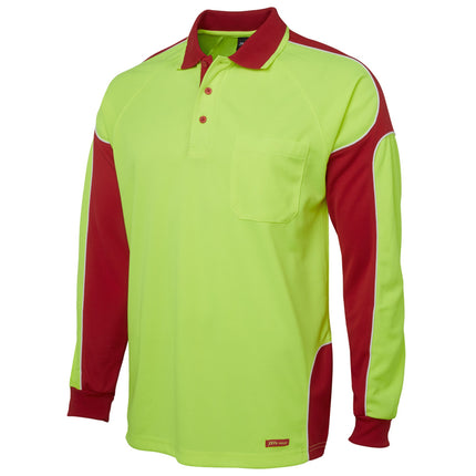 A close-up of a long-sleeve polo shirt. The shirt is neon yellow with red side panels and sleeves, outlined with white piping. It has a high collar with two thin stripes.