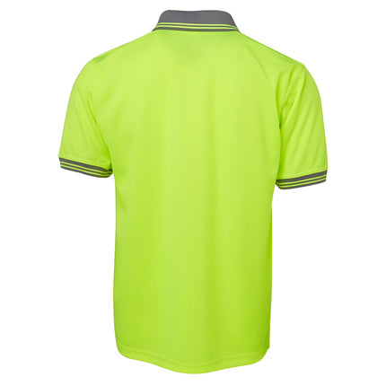 A rear view of a two-tone polo shirt. The back is all neon yellow, and the collar and sleeve cuffs are gray with two thin stripes.