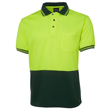 A front view of a two-tone polo shirt. The top is neon yellow, and the bottom and collar are dark green. It has two thin stripes on the collar and sleeves and a single chest pocket.