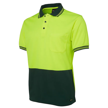 A close-up of a two-tone polo shirt. The top is neon yellow, and the bottom and collar are dark green. It has thin stripes on the collar and sleeves.