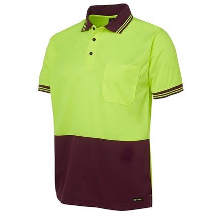 A close-up of a two-tone polo shirt. The top is neon yellow, and the bottom and collar are maroon. It has thin stripes on the collar and sleeves.