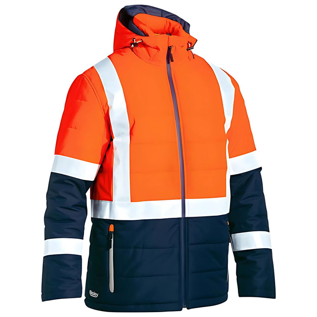 A close-up of a two-tone, high-visibility work jacket. The upper part is bright orange with white reflective stripes. The lower part is dark blue with matching stripes on the arms.