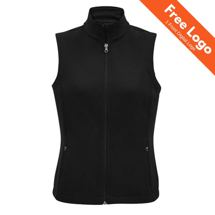 The Biz Collection Women's Apex 2-Layer Softshell Vest in black is sleeveless with a full front zipper and zippered pockets, shown on a white background. An orange banner at the top right states, “Free Logo, 1 Front Digital Logo.”.