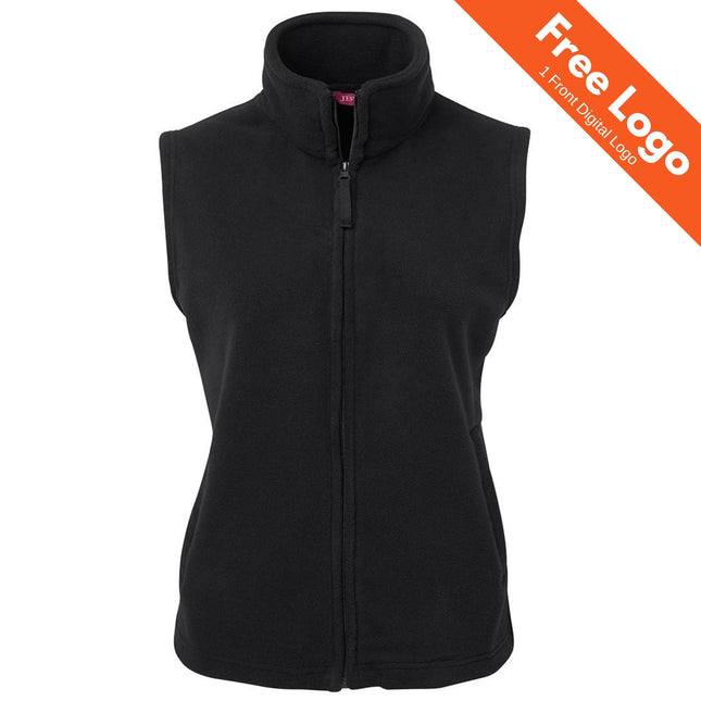 JB's Wear Ladies Polar Vest - Warm & Durable Fleece, sleeveless and black with a full front zipper and high collar, shown on a white background. An orange banner at the top right reads: Free Logo 1 Front Digital Logo.