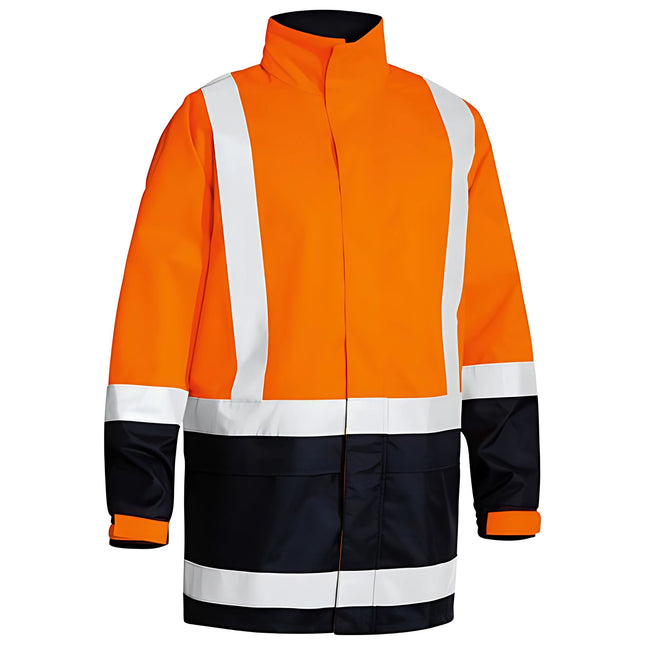 A close-up of a two-tone work jacket. The jacket is orange and dark blue with a high collar and white reflective stripes on the torso and arms.