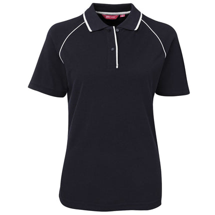 The JB's Wear Ladies Raglan Polo by JB's Wear features plain black fabric, white piping on shoulder seams and collar, and a three-button placket—perfect as a polished uniform polo shirt.