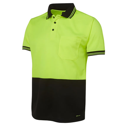 A close-up of a two-tone polo shirt. The top is neon yellow, and the bottom and collar are black. It has two thin stripes on the collar and sleeves.