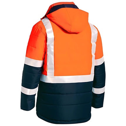 A view from the back of a two-tone work jacket. The upper part is bright orange, and the lower part is dark blue. Two white reflective stripes cross the back horizontally.