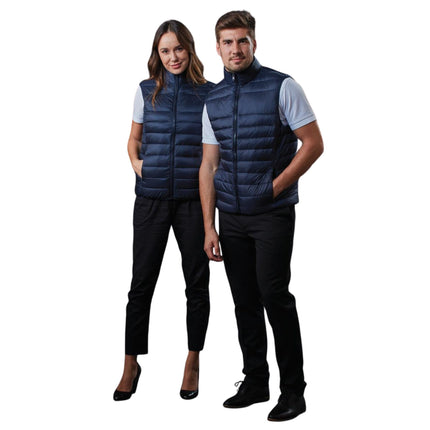 The ArcticGlow™ Women’s Lightweight Quilted Puffer Vest offers exceptional warmth without bulk, designed for comfort and mobility in cooler conditions.