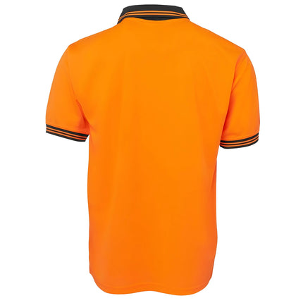 A rear view of a two-tone polo shirt. The back is all orange, and the bottom and sleeve cuffs are black with thin orange stripes.