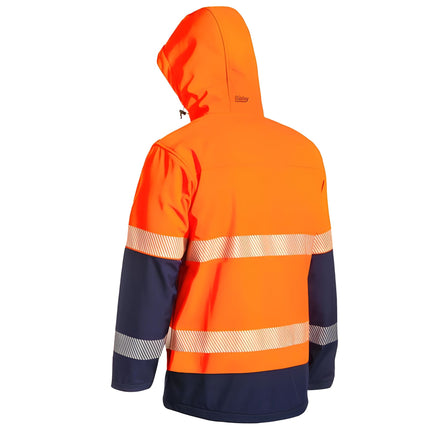 A rear view of a two-tone work jacket. The jacket is orange and dark blue with a hood and two wide, reflective stripes across the back.