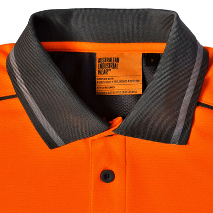 A close-up of the bright orange and dark gray side panels of the shirt, showing the mesh fabric texture.
