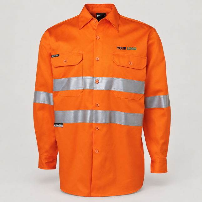 Illustrative front-view branding mock-up of JB's Wear 6HDNL Orange shirt with small navy-and-teal YOUR LOGO embroidery above the wearer-left chest pocket on a warm grey background.