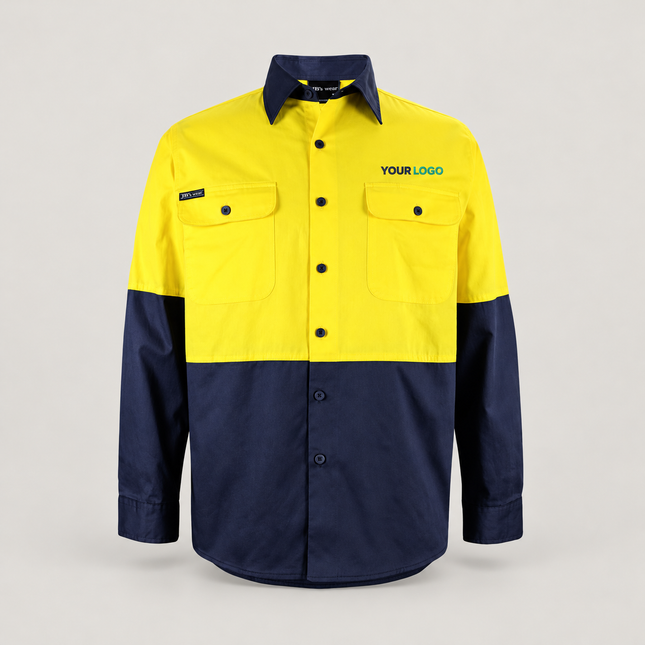 Illustrative front-view branding mock-up of JB's Wear 6HWSL Yellow/Navy shirt with small navy-and-teal YOUR LOGO embroidery above the wearer-left chest pocket on a warm grey background.