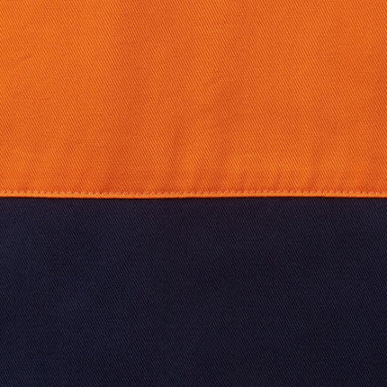A close-up of a two-tone fabric. The top half is bright orange and the bottom is dark blue, separated by a line of stitching.