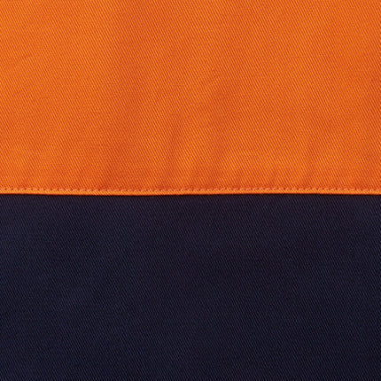 A close-up of a two-tone fabric. The top half is bright orange and the bottom is dark blue, separated by a line of stitching.