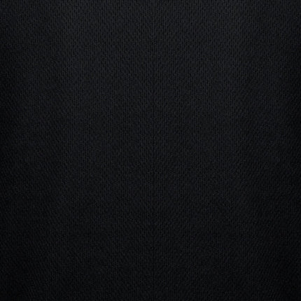 A macro shot of black fabric. The texture is a fine mesh with a pattern of small, interlocking diamonds.