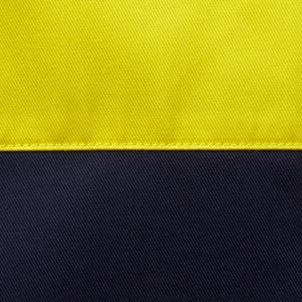 A close-up of a two-tone fabric. The top half is bright yellow and the bottom is dark blue, separated by a line of stitching.