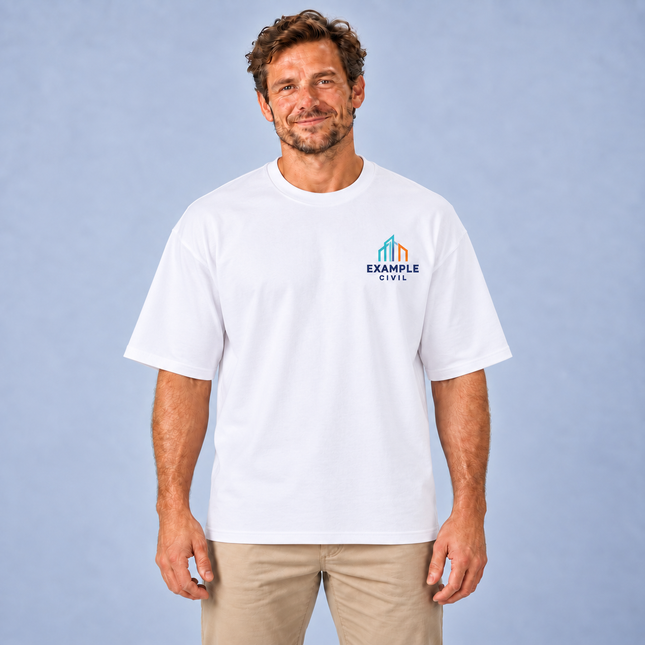 Professional model wearing the white AS Colour 5080 Heavy Tee with an illustrative full-colour EXAMPLE CIVIL digital print on the left chest
