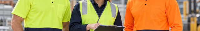 Workwear campaign image showing two adults in yellow and navy short-sleeve and orange and navy long-sleeve polos beside an adult wearing a yellow hi-vis vest and white hard hat.
