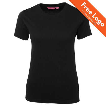 A JB's Wear Ladies Tee 100% Cotton in plain black is displayed on a white background. An orange banner in the top right corner says, Free Logo - 1 Front Digital Logo.