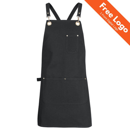 The JB's Wear Brass Eyelet Apron with Strap by JB's Wear features cross-back straps, three front pockets, and metallic rings. Made from durable cotton duck canvas. Orange "Free Logo 1 Front Digital Logo" banner in top right. Stylish for work use.