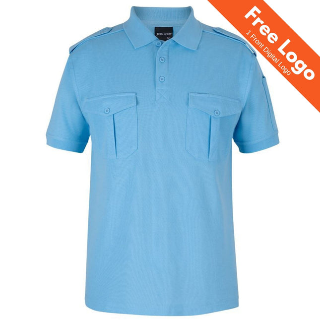 The JB’s Wear 250 Short Sleeve Epaulette Polo by JB’s Wear features light blue fabric, buttoned chest pockets, and shoulder epaulettes. An orange banner in the top right announces “Free Logo | 1 Front Digital Logo.”.