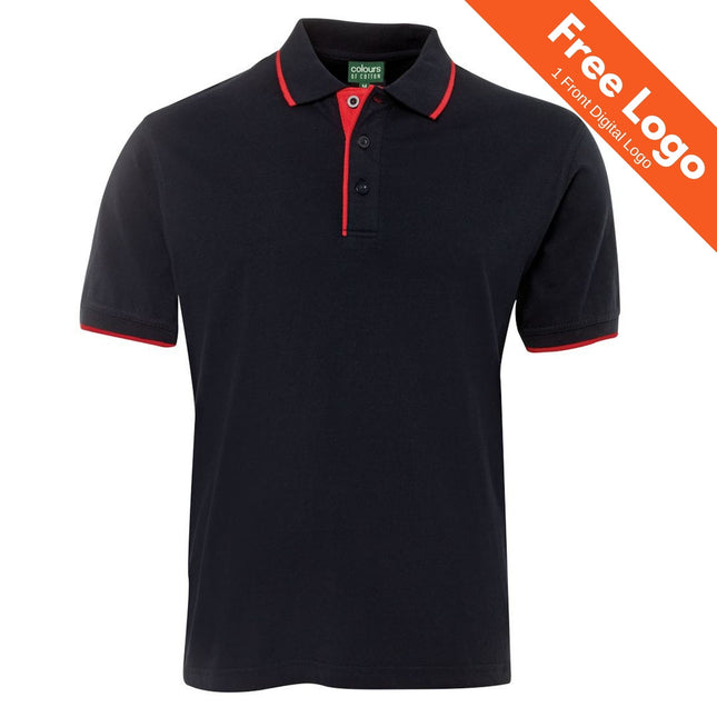 The JB's Wear Tipping Polo by JB's Wear is a black cotton shirt with red trim on the collar and sleeves. An orange banner in the top right reads "Free Logo 1 Front Digital Logo," making it ideal for custom uniforms.