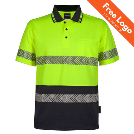 JB's Wear Hi-Vis Short Sleeve Segmented Tape Polo in yellow and navy with reflective tape, pocket, and "Free Logo 1 Front Digital Logo" offer in an orange top-right banner. Brand: JB's Wear.