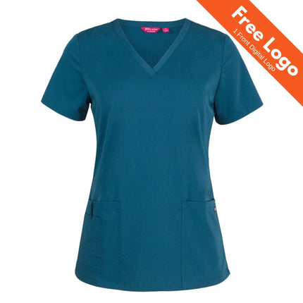 JB's Wear Ladies NU Scrub Top by JB's Wear: teal, short sleeves, V-neck, and two front pockets—ideal for healthcare. An orange banner in the top right corner states "Free Logo 1 Front Digital Logo.