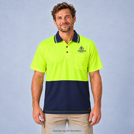 Model wearing a Workcraft WSP208 yellow and navy short sleeve hi-vis micromesh polo, with a navy EXAMPLE CIVIL single-colour screen-print logo above the left chest pocket, against a soft grey studio background.