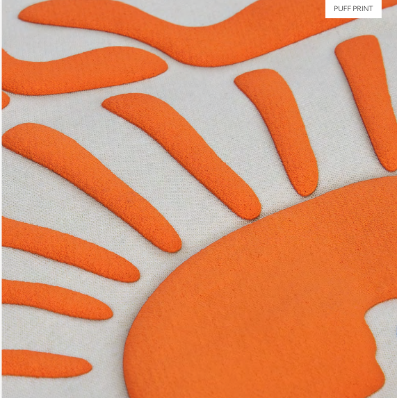 Close-up of orange raised puff print on fabric