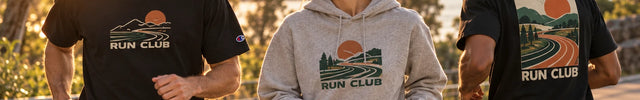 Runners wearing customised Champion-style T-shirts and a grey hoodie at sunset