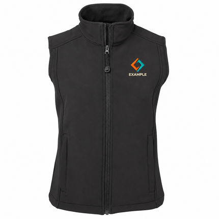 JB's Wear Ladies Urban Fit Soft Shell Vest in its original garment colour, with an illustrative EXAMPLE embroidered logo on the front chest. Logo example only; front embroidery only.