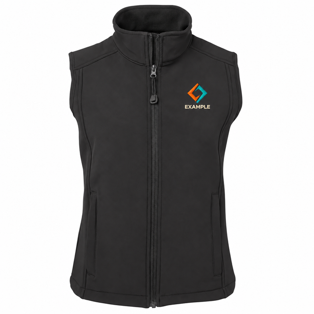 JB's Wear Ladies Urban Fit Soft Shell Vest in its original garment colour, with an illustrative EXAMPLE embroidered logo on the front chest. Logo example only; front embroidery only.