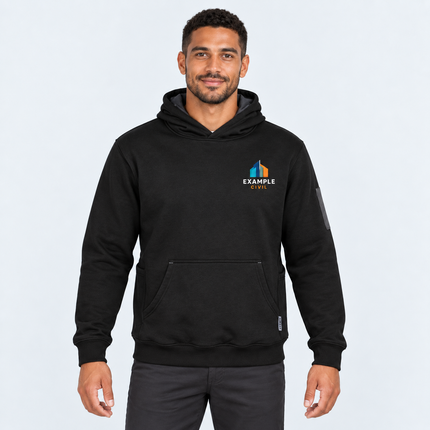 Model wearing Syzmik Unisex Multi-Pocket Hoodie ZT467 in Black/Charcoal with an illustrative full-colour EXAMPLE CIVIL left-chest digital print, against a light cool-grey studio background.